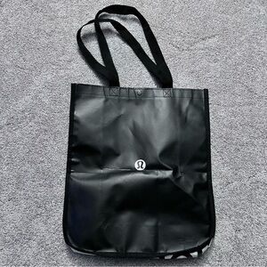 Lululemon black and white shopping bag with one snap